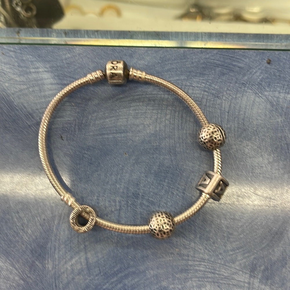 Pandora bracelet silver with 4 charms 7 inches